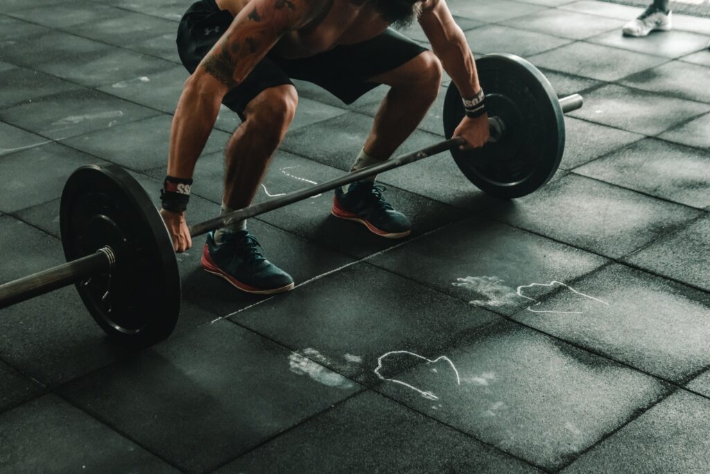 male crossfit athlete prepares to lift a barbell